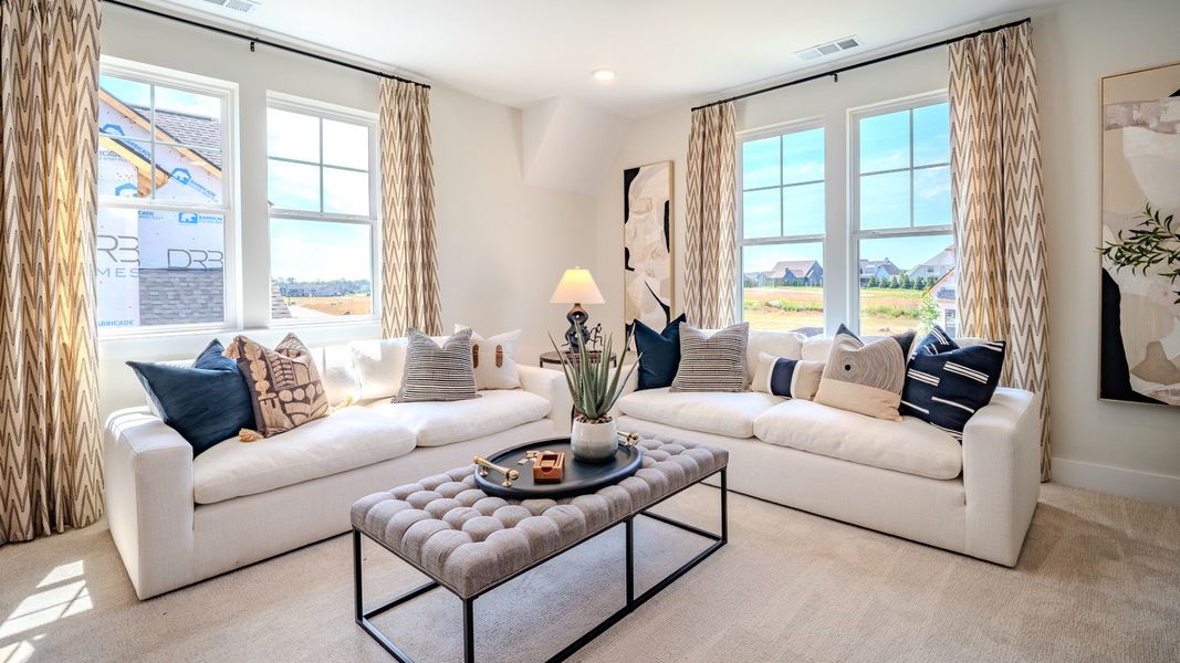 Bonus room with carpet flooring and plenty windows
