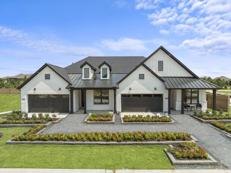 Front exterior of a home in the Gatherings® at Chambers Creek: Duets community, located in Willis, TX (Image 2).