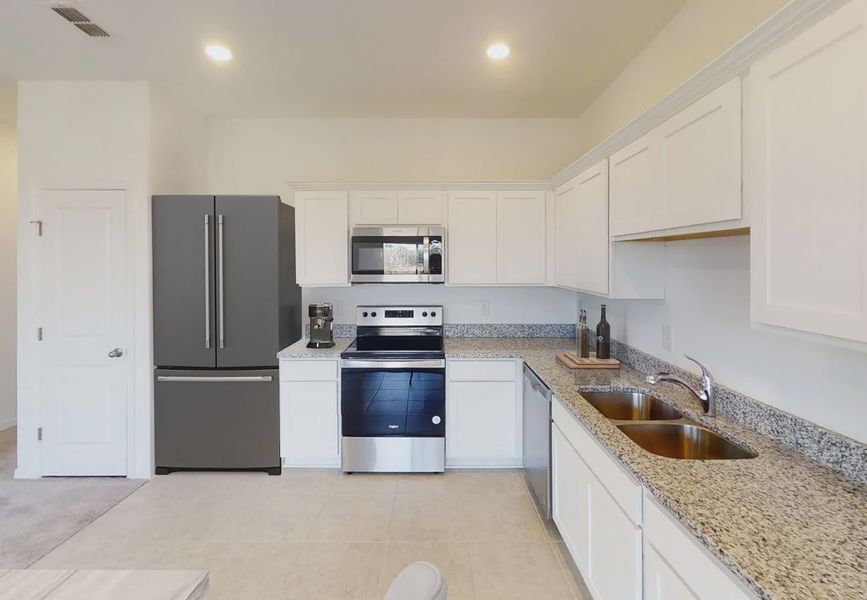 Furnished interior in a model home at Temples Crossing in Davenport (Image 5).