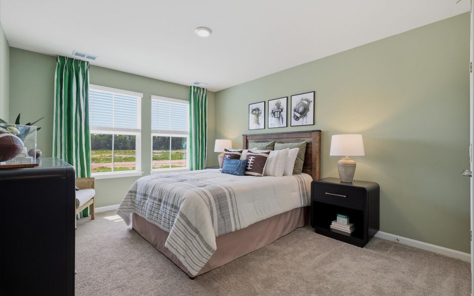 Furnished interior in a model home at Riverwalk Pointe at Mallory Creek - Townhomes in Leland (Image 29). Furnished interior in a model home at Riverwalk Pointe at Mallory Creek - Townhomes in Leland (Image 29).