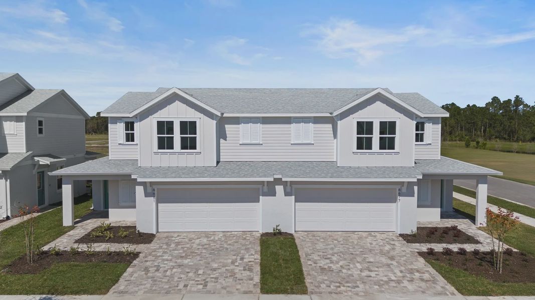 Cyrene at Harmony by DRB Homes offers a two-car garage with a beautiful paver driveway—blending style, space, and convenience Cyrene at Harmony by DRB Homes offers a two-car garage with a beautiful paver driveway—blending style, space, and convenience