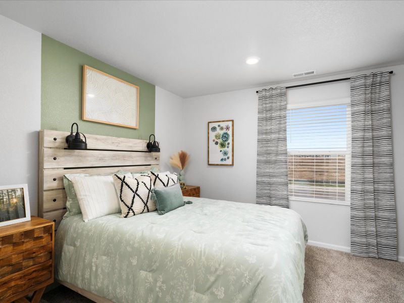 Furnished interior in a model home at Frontier Estates - The Trails Collection in Firestone (Image 12).
