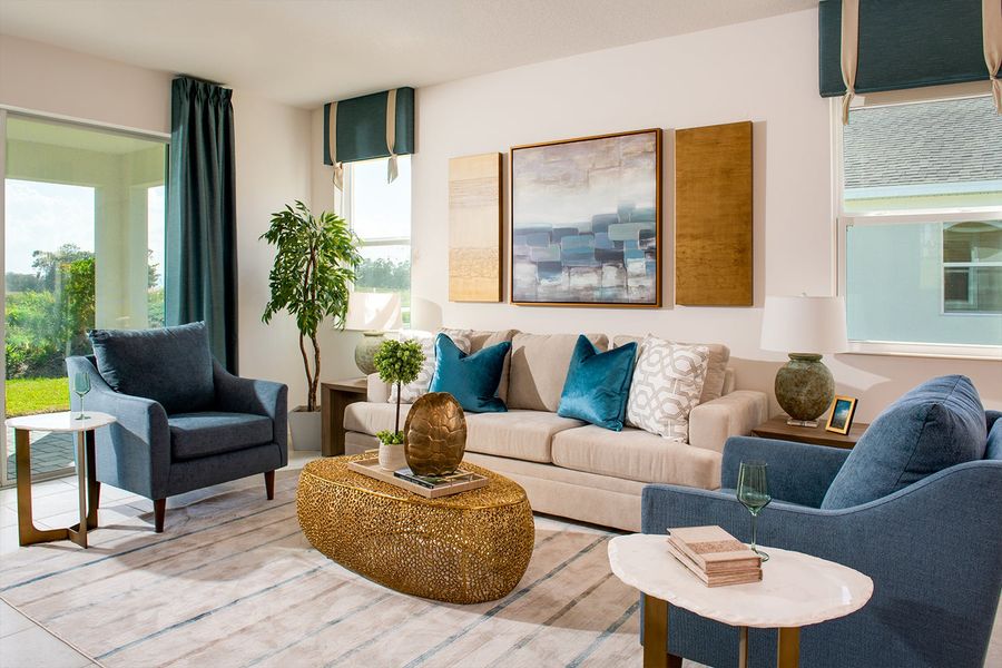 Furnished interior in a model home at Highfield at Twisted Oaks in Wildwood (Image 34).