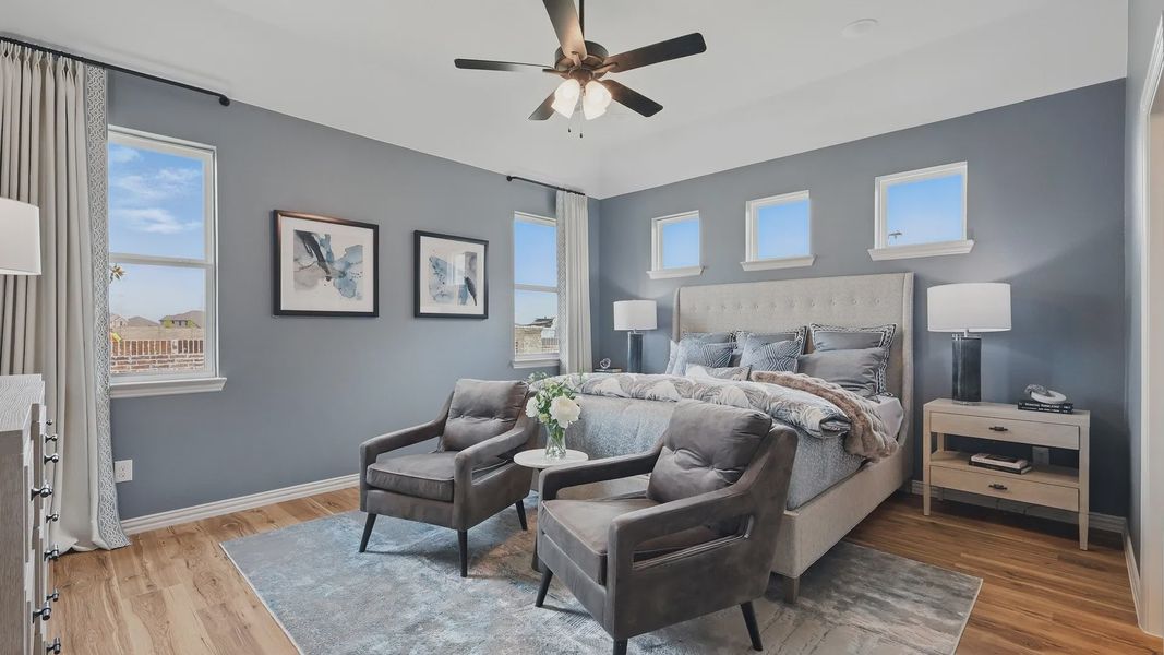 Experience luxury with modern decor, plush bedding, and rich wood flooring in Westridge community.
