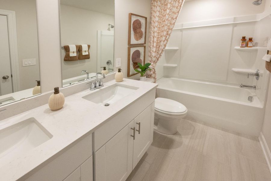 Furnished interior in a model home at Chatham Forest in Duncan (Image 13).