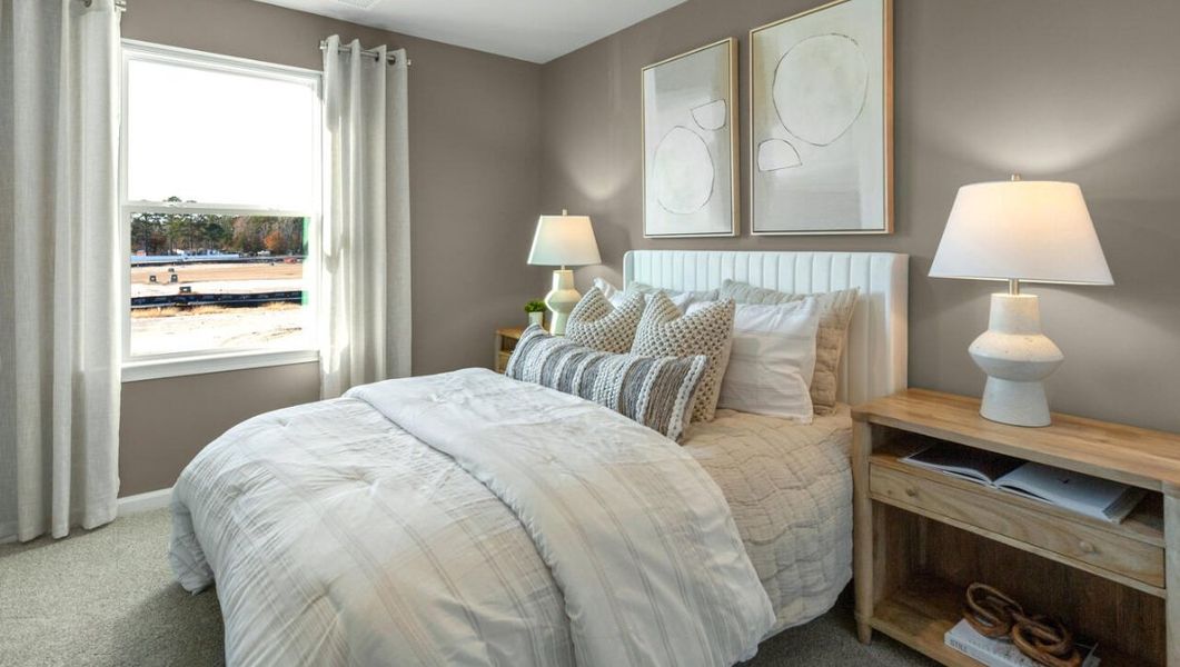 Furnished interior in a model home at Waterside Townhomes in Surf City (Image 22).