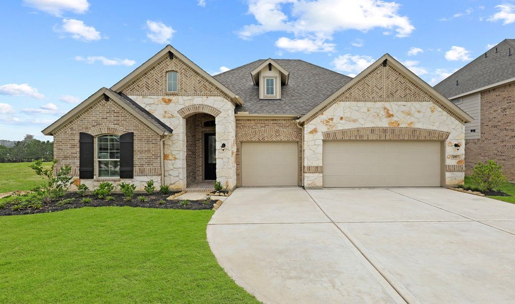 Front exterior of a home in the Waterstone on Lake Conroe community, located in Montgomery, TX (Image 9).