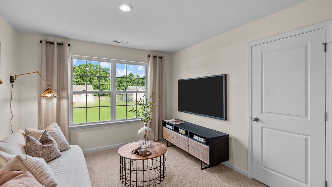 Furnished interior in a model home at The Preserve at Kinsley in Jamestown (Image 21).