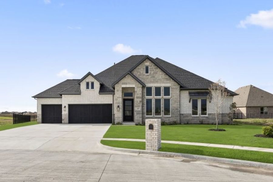 Front exterior of a home in the Heath Golf and Yacht Club community, located in Rockwall, TX (Image 24).