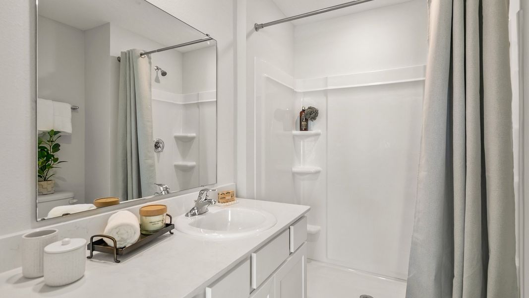 Furnished interior in a model home at Stokes Landing in St. Augustine (Image 17).