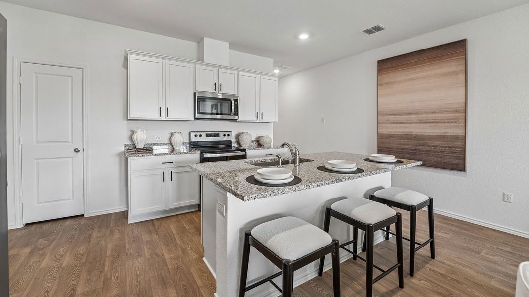Furnished interior in a model home at Palomino in Manor (Image 23).