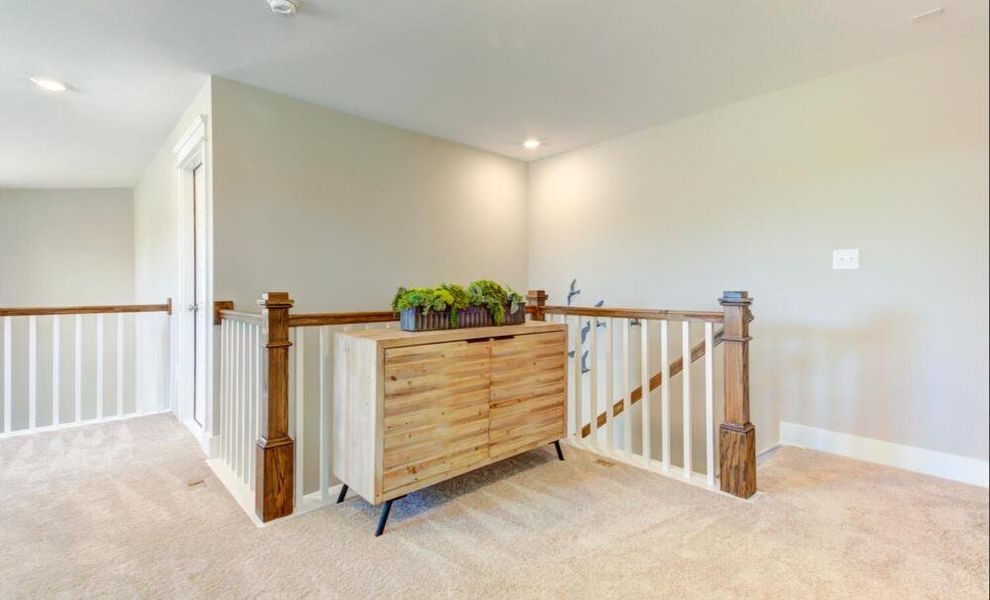 Furnished interior in a model home at CraigStone in Woodruff (Image 13).