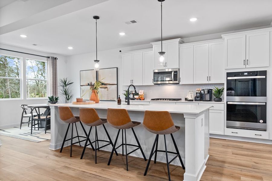 A kitchen with white cabinets. A kitchen with white cabinets.