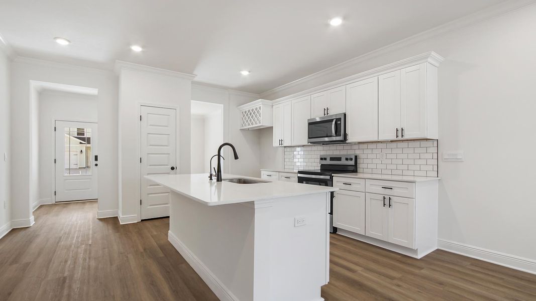 Furnished interior in a model home at Nellie Preserve in Santa Rosa Beach (Image 5).