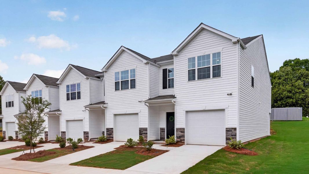 Front exterior of a home in the The Townes at Troutman community, located in Troutman, NC (Image 2). Front exterior of a home in the The Townes at Troutman community, located in Troutman, NC (Image 2).