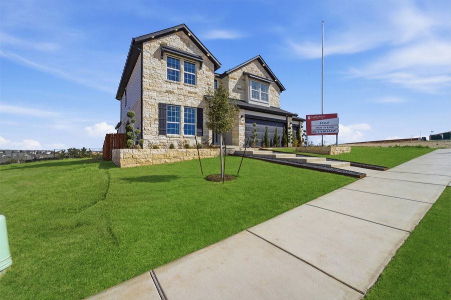 Front exterior of a home in the Lariat community, located in Liberty Hill, TX (Image 2).