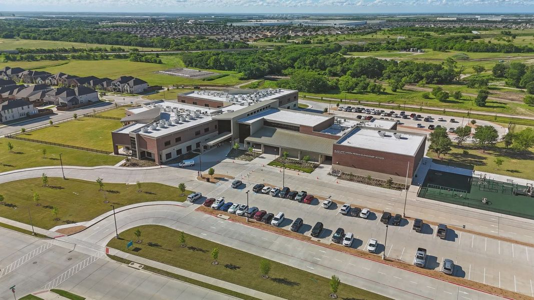 Elegant school design with sleek lines and expansive green spaces in Wildflower Ranch. Elegant school design with sleek lines and expansive green spaces in Wildflower Ranch.