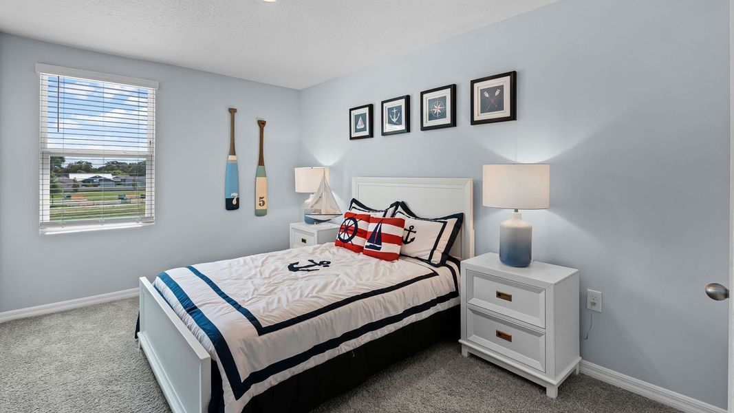 Furnished interior in a model home at Fish Lake Cove in Kissimmee (Image 27).