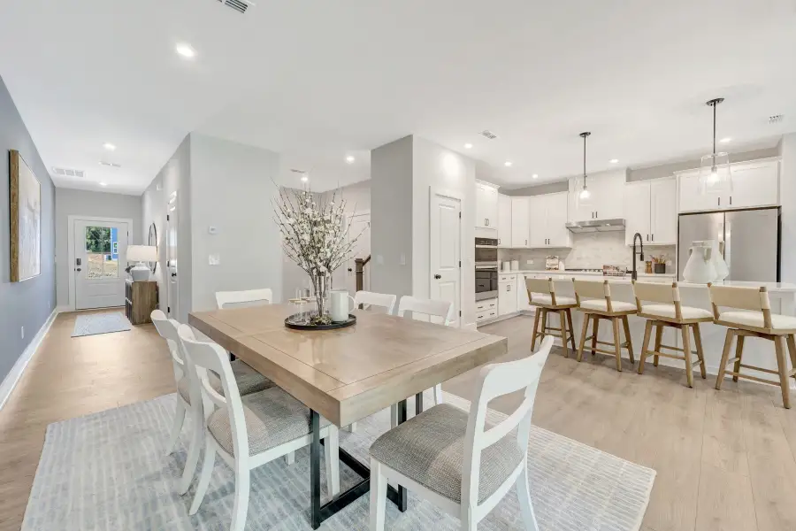 Furnished interior in a model home at Friendship Village Townhomes in Apex (Image 3).