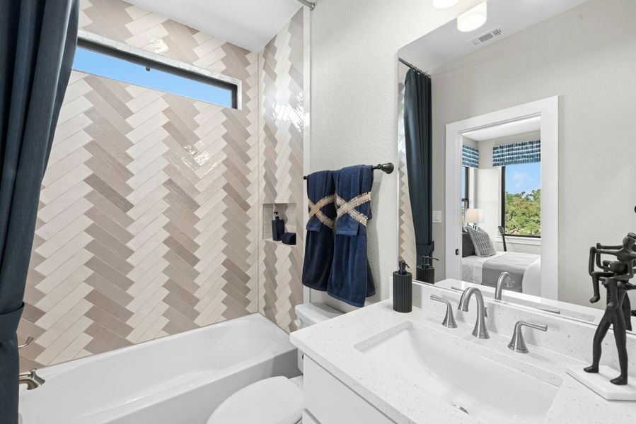 Furnished interior in a model home at Caliterra in Dripping Springs (Image 59).