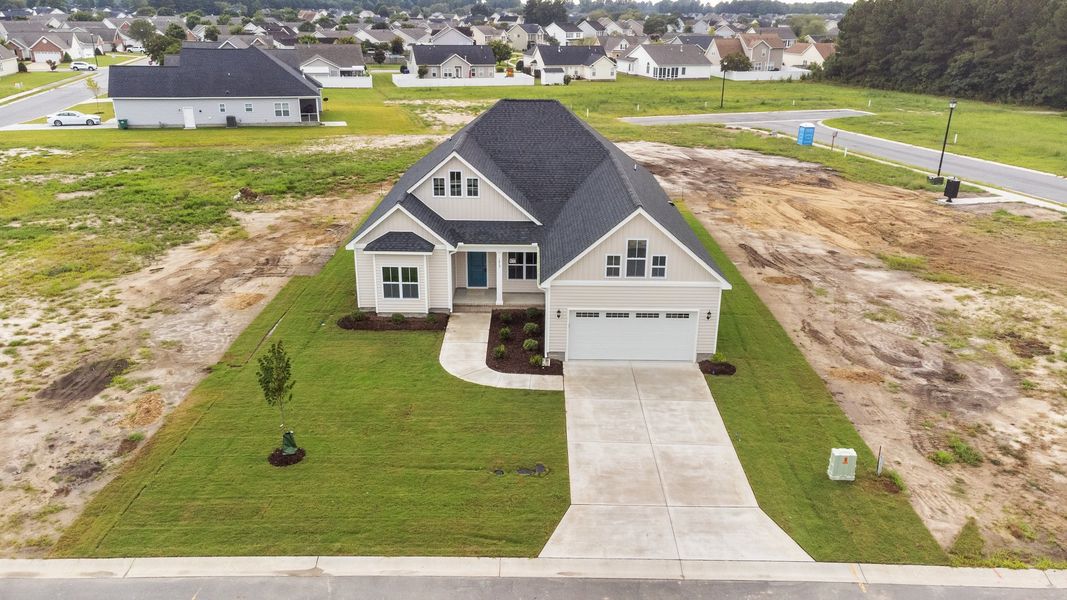 Front exterior of a home in the The Villas at Langston Farms community, located in Winterville, NC (Image 13).