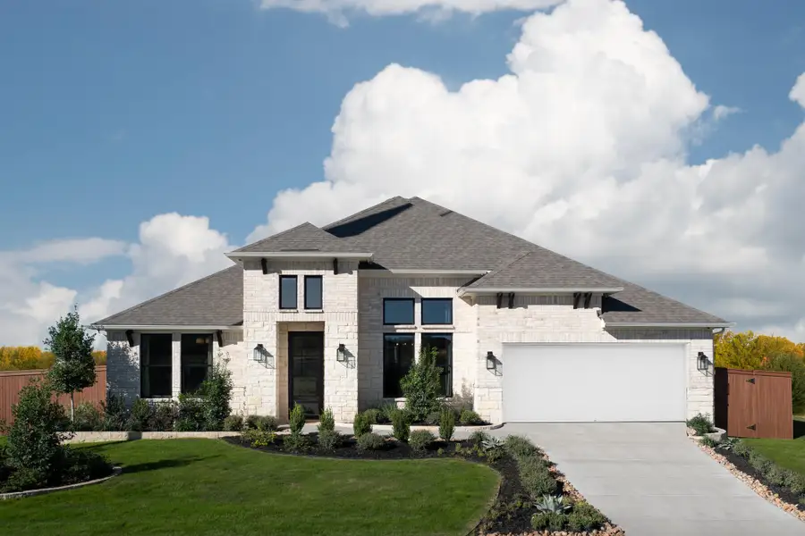 Front exterior of a home in the Megan's Landing 70's community, located in Castroville, TX (Image 2).