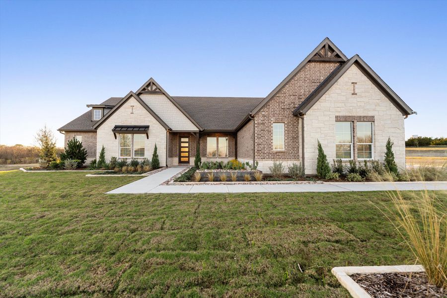 Front exterior of a home in the Grayson Ridge community, located in Van Alstyne, TX (Image 1).