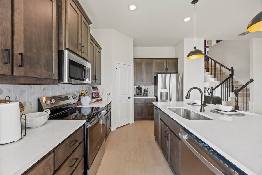 Furnished interior in a model home at El Dorado in Granbury (Image 6).