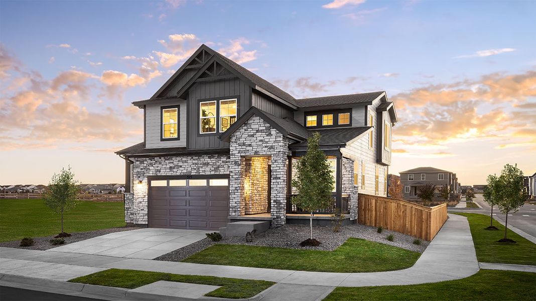 Front exterior of a home in the The Cottages Collection at Ridgeline Vista community, located in Brighton, CO (Image 1).