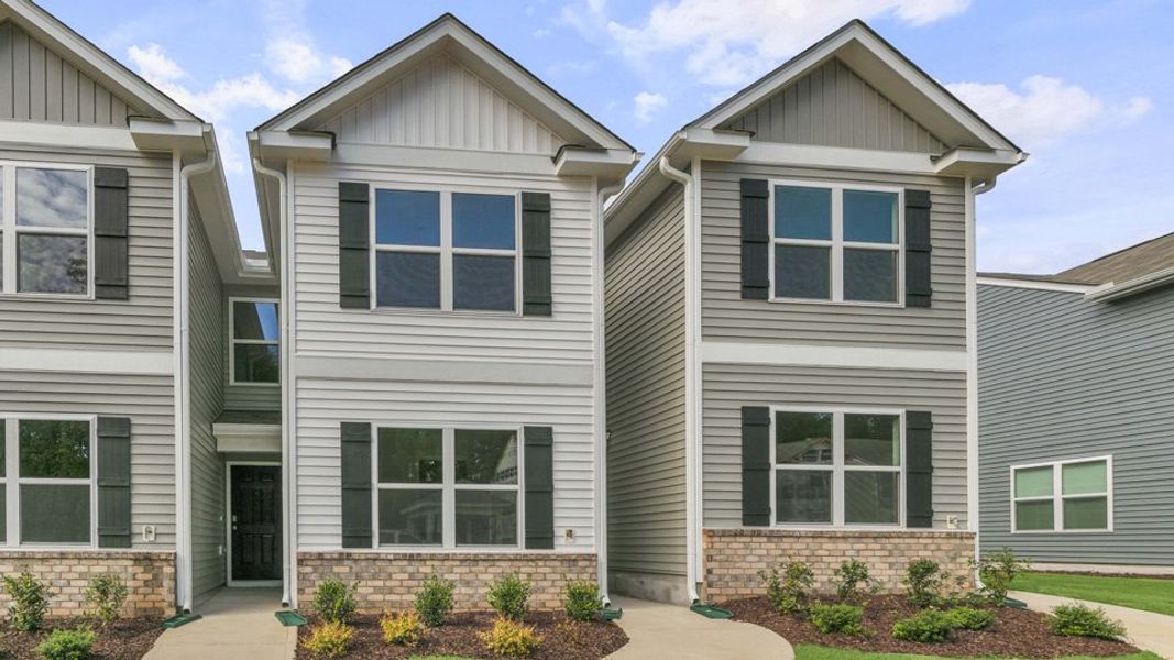 Front exterior of a home in the The Townes at Wilson's Ridge community, located in Wilson's Mills, NC (Image 19).