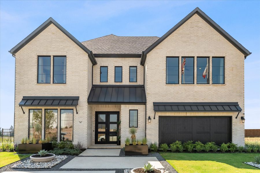 Front exterior of a home in the Estates at Rockhill community, located in Frisco, TX (Image 4).