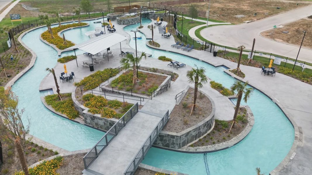 Experience modern elegance with a flowing lazy river and lush landscaping at Wildflower Ranch, Texas. Experience modern elegance with a flowing lazy river and lush landscaping at Wildflower Ranch, Texas.