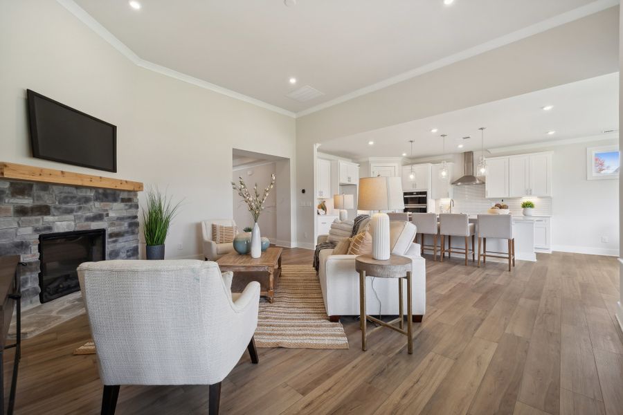 A large living room with a fireplace. A large living room with a fireplace.