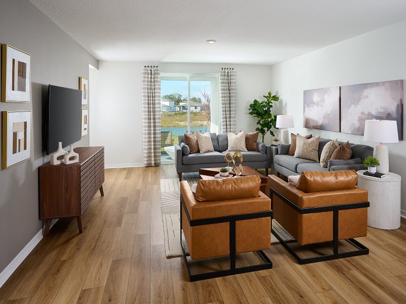 Furnished interior in a model home at Oakfield Trails - Classic Series in Parrish (Image 6).