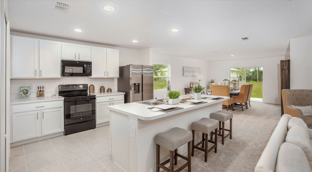 Furnished interior in a model home at Woodland Ranch in Lake Wales (Image 2). Furnished interior in a model home at Woodland Ranch in Lake Wales (Image 2).