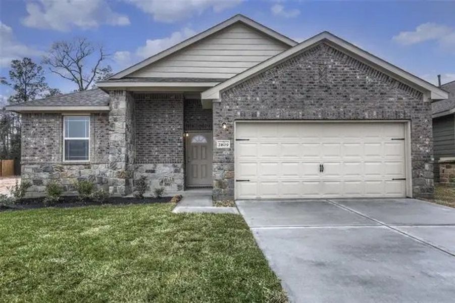 Front exterior of a home in the Clear View Estates community, located in Willis, TX (Image 3).