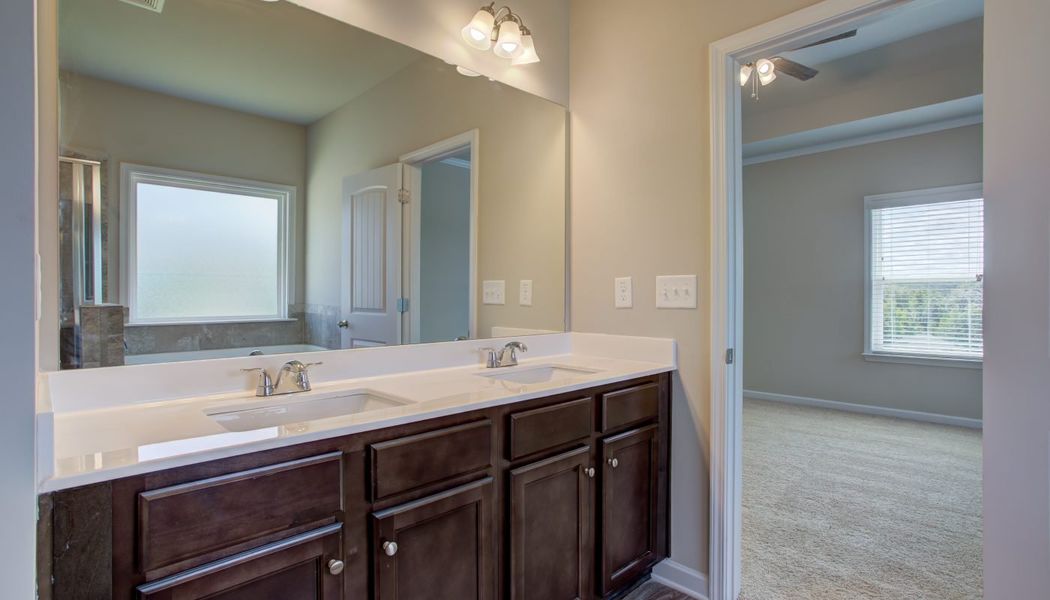 Furnished interior in a model home at North Village in Rydal (Image 23).