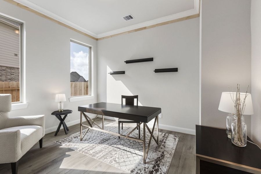 Furnished interior in a model home at Sunterra in Katy (Image 28).