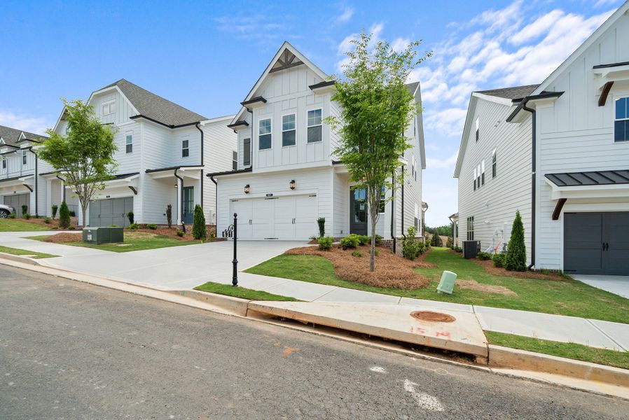 Front exterior of a home in the Palisades Single Family community, located in Cumming, GA (Image 4).