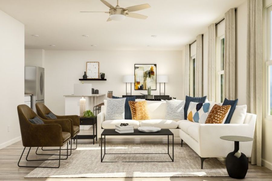 A living room with a white couch and a coffee table.