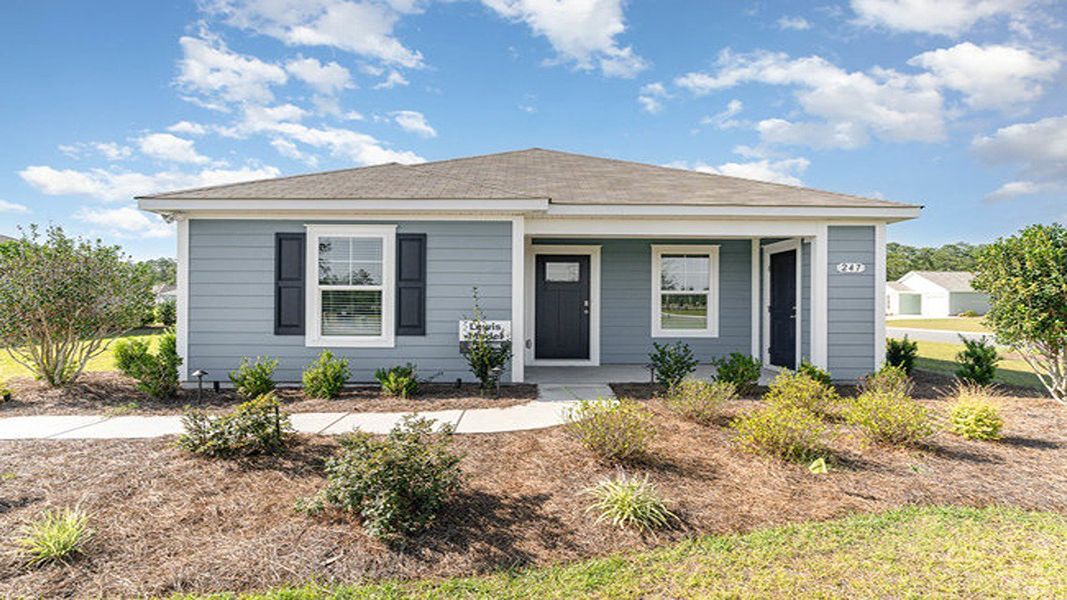 Front exterior of a home in the Sandpiper Place community, located in Myrtle Beach, SC (Image 9).