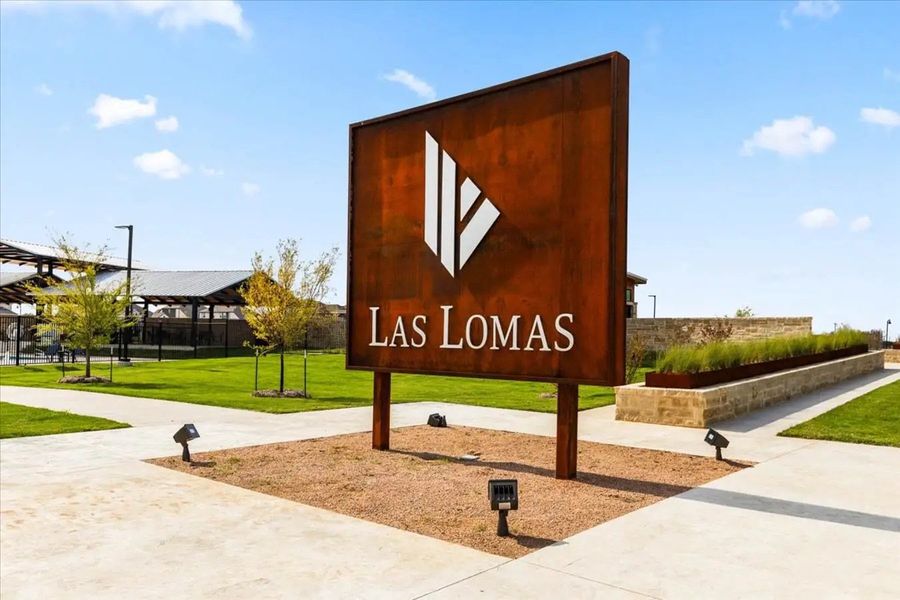 Main entrance to the Las Lomas master-planned community in Forney, TX, featuring its landmark signage (Image 6). Main entrance to the Las Lomas master-planned community in Forney, TX, featuring its landmark signage (Image 6).