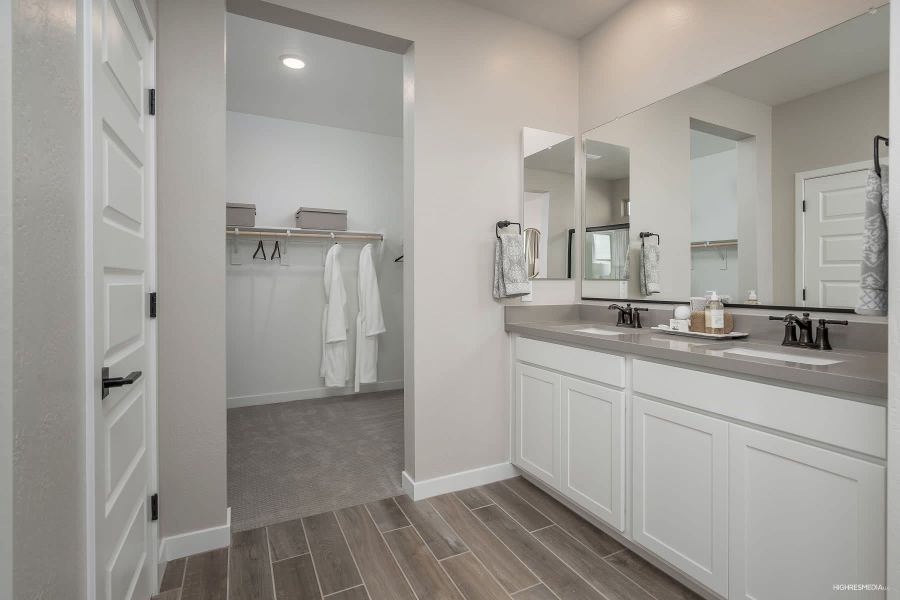 Primary Bathroom to Walk-in Closet - Sabino at Sunset Farms in Tolleson, Arizona | Landsea Homes