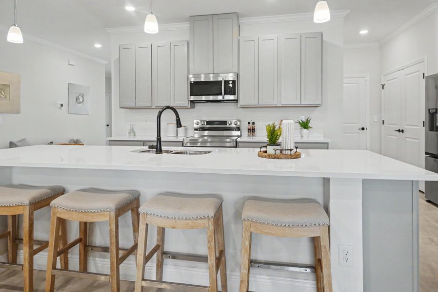 Furnished interior in a model home at Cape Coral Signature in Cape Coral (Image 3). Furnished interior in a model home at Cape Coral Signature in Cape Coral (Image 3).