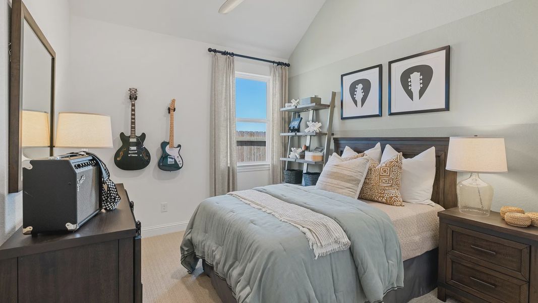 Experience vaulted ceilings and contemporary decor in this luxurious Southern Pointe bedroom.