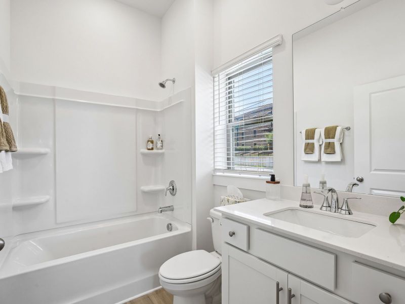 Furnished interior in a model home at Preston Park in Spring Hill (Image 7).