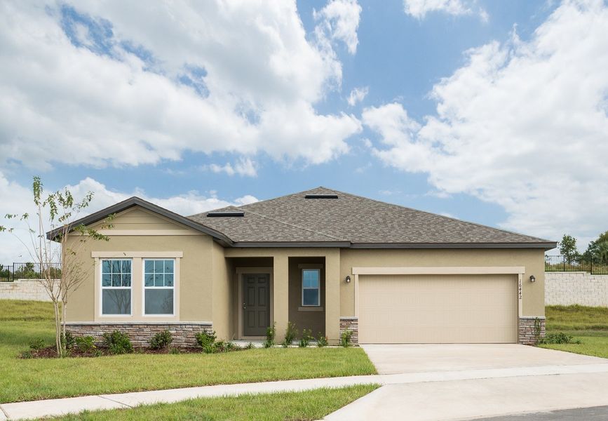 Front exterior of a home in the Vista Walk community, located in Dade City, FL (Image 1).