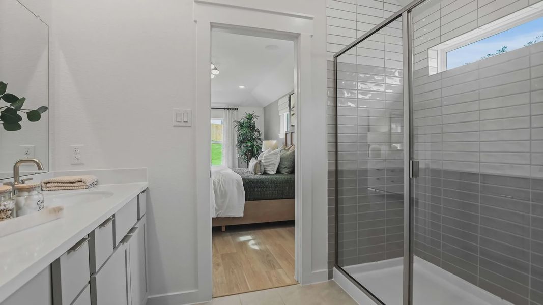 Elegant glass shower and sleek vanity define luxury in Mostyn Springs. Elegant glass shower and sleek vanity define luxury in Mostyn Springs.