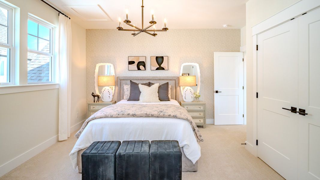Bedroom with carpet and windows