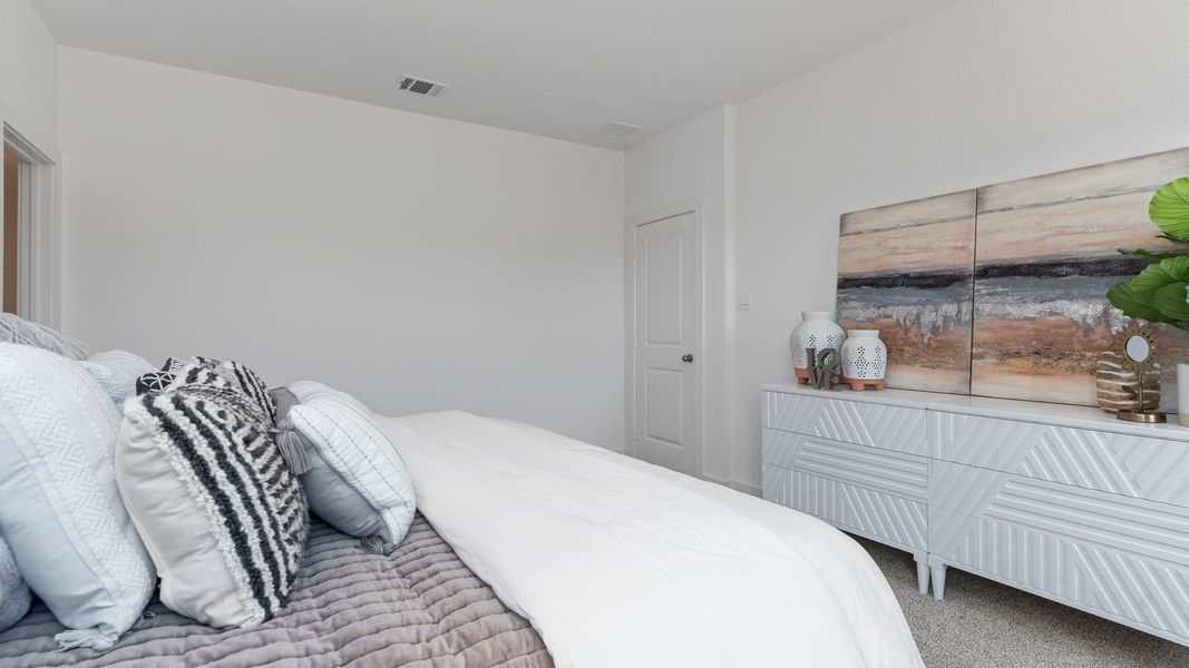 Furnished interior in a model home at August Trails in Needville (Image 23).